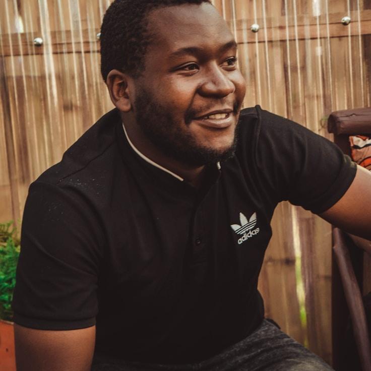 Ava Singh, Lead Design Curator at MellowMeadowCurrent, reviewing corporate floral arrangements